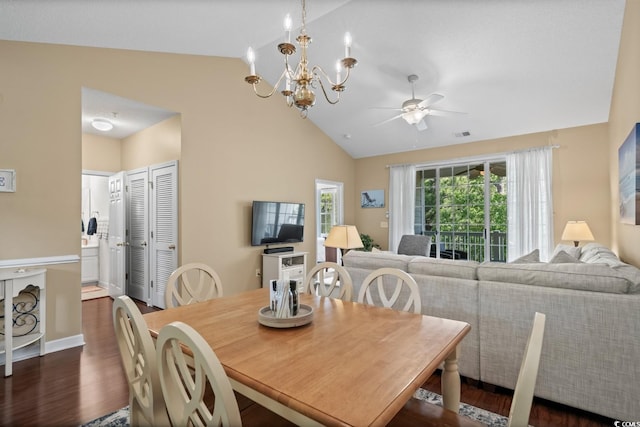 dining space with lofted ceiling, dark wood-style floors, ceiling fan, and a chandelier