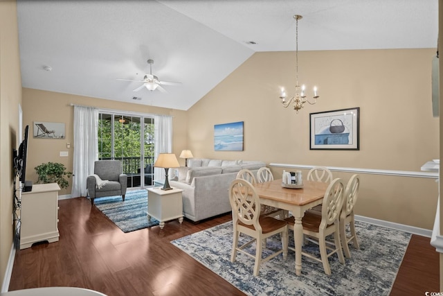 dining space featuring a chandelier, lofted ceiling, ceiling fan, wood finished floors, and baseboards