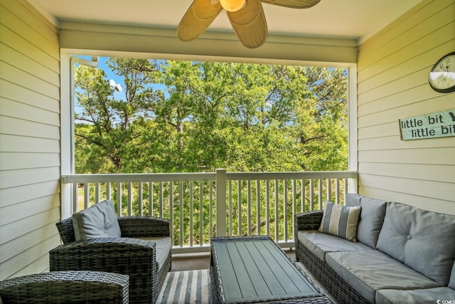 balcony with a ceiling fan and an outdoor living space