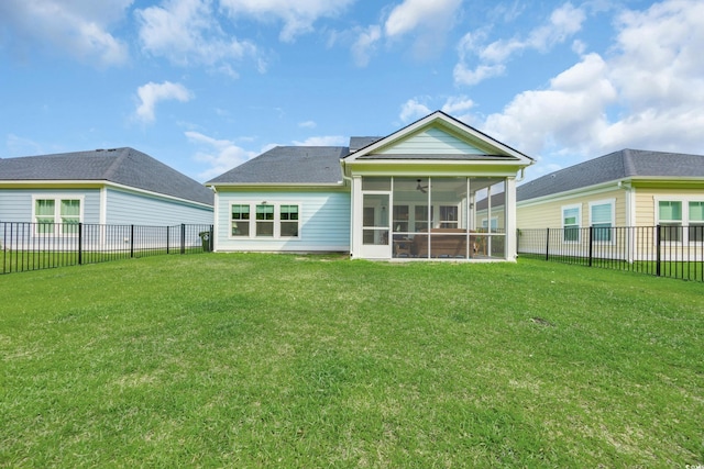 rear view of property featuring a sunroom