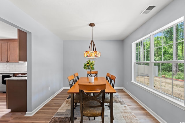 480 Dandelion Ln, Myrtle Beach, SC 29579 - dining room featuring healthy amount of natural light, light wood-style flooring, and baseboards
