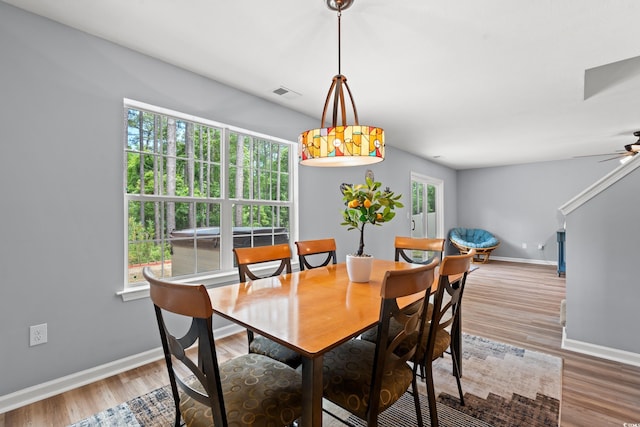 480 Dandelion Ln, Myrtle Beach, SC 29579 - dining space featuring baseboards, wood finished floors, and ceiling fan