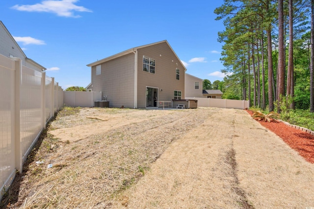 480 Dandelion Ln, Myrtle Beach, SC 29579 - rear view of house with central AC and a fenced backyard