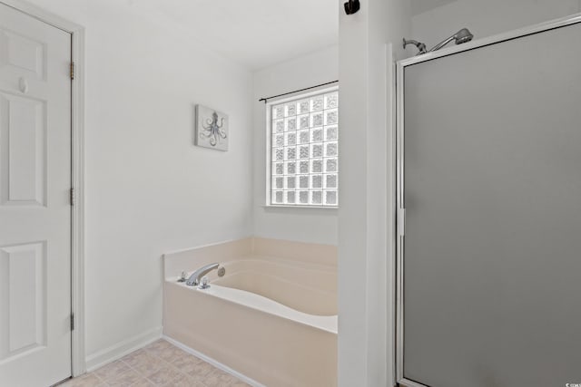 480 Dandelion Ln, Myrtle Beach, SC 29579 - bathroom with a garden tub, a stall shower, and baseboards