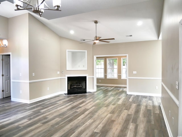 104 Jessica Lakes Dr, Conway, SC 29526 - unfurnished living room with a chandelier, a ceiling fan, vaulted ceiling, wood finished floors, and a fireplace