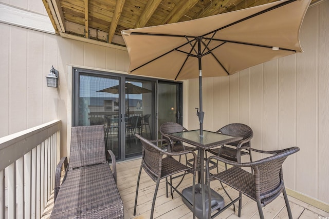 9661 Shore Dr Unit B-3, Myrtle Beach, SC 29572 - wooden terrace with outdoor dining area