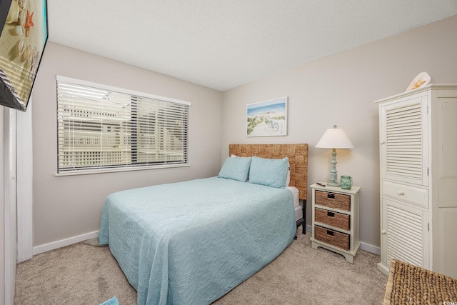 9661 Shore Dr Unit B-3, Myrtle Beach, SC 29572 - bedroom featuring light carpet and baseboards