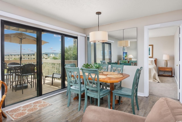 9661 Shore Dr Unit B-3, Myrtle Beach, SC 29572 - dining room featuring wood finished floors and baseboards