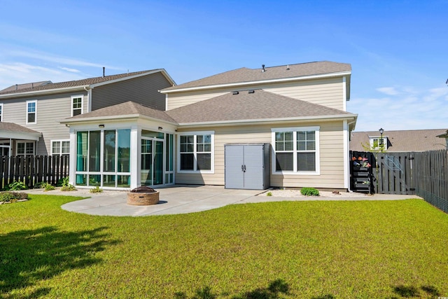 1808 Zodiac Ct, Myrtle Beach, SC 29577 - back of house with a sunroom, a patio area, a fire pit, and a shingled roof