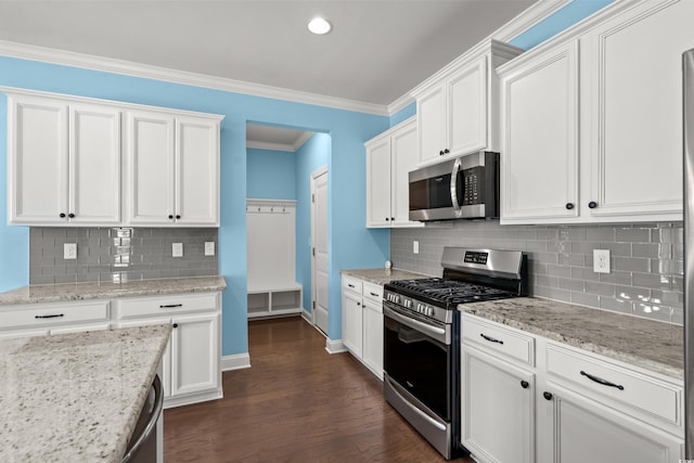 1808 Zodiac Ct, Myrtle Beach, SC 29577 - kitchen featuring stainless steel appliances, white cabinets, tasteful backsplash, dark wood-type flooring, and light stone counters