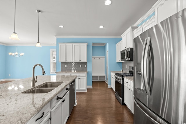 1808 Zodiac Ct, Myrtle Beach, SC 29577 - kitchen featuring stainless steel appliances, a sink, tasteful backsplash, white cabinets, and a chandelier