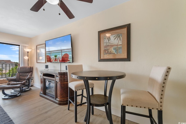 7509 N Ocean Blvd Unit 404, Myrtle Beach, SC 29572 - dining space featuring light wood-style floors, ceiling fan, and baseboards