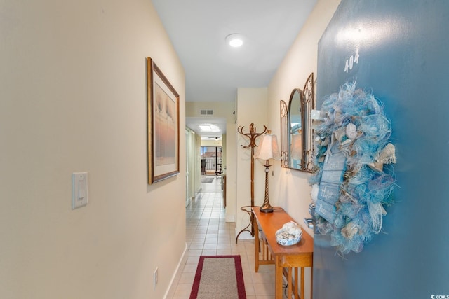 7509 N Ocean Blvd Unit 404, Myrtle Beach, SC 29572 - hallway with light tile patterned floors and baseboards