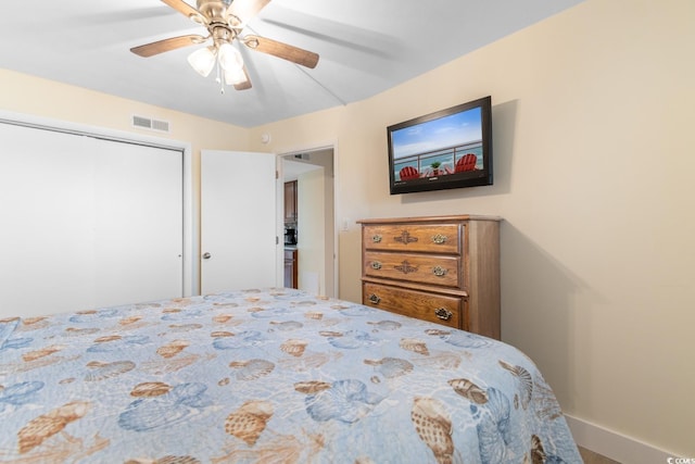 7509 N Ocean Blvd Unit 404, Myrtle Beach, SC 29572 - bedroom with ceiling fan, baseboards, and a closet