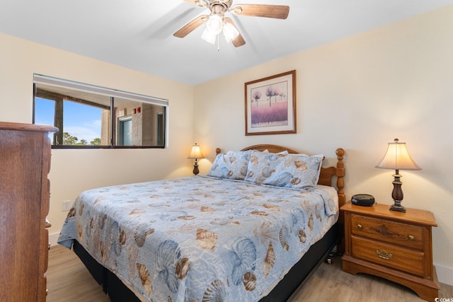 7509 N Ocean Blvd Unit 404, Myrtle Beach, SC 29572 - bedroom featuring wood finished floors and ceiling fan