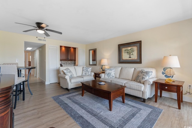 7509 N Ocean Blvd Unit 404, Myrtle Beach, SC 29572 - living area with ceiling fan, light wood finished floors, and baseboards