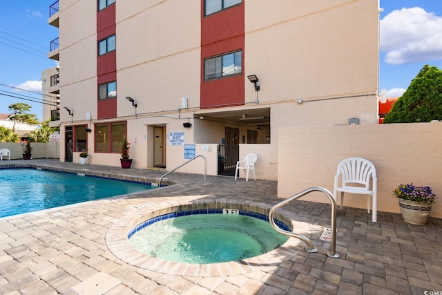 7509 N Ocean Blvd Unit 404, Myrtle Beach, SC 29572 - community pool featuring a community hot tub, a patio area, and fence