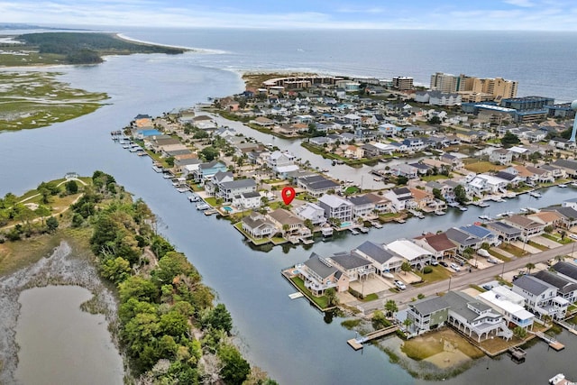 337 59th Ave N, North Myrtle Beach, SC 29582 - aerial overview of property's location with a large body of water and nearby suburban area