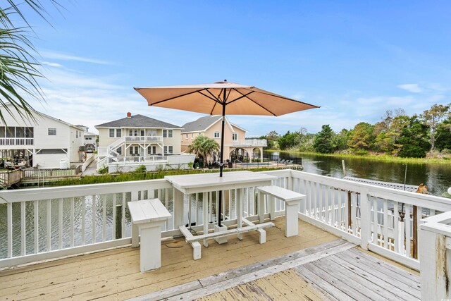 337 59th Ave N, North Myrtle Beach, SC 29582 - wooden terrace with a water view