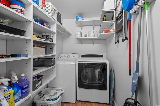 337 59th Ave N, North Myrtle Beach, SC 29582 - laundry area featuring independent washer and dryer and wood finished floors