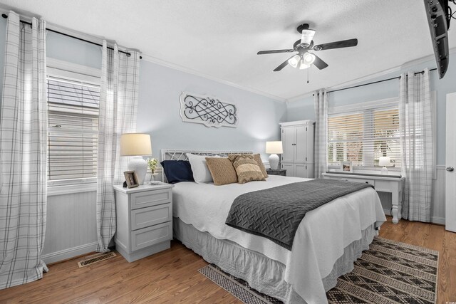 337 59th Ave N, North Myrtle Beach, SC 29582 - bedroom featuring light wood-type flooring, ornamental molding, ceiling fan, and baseboards