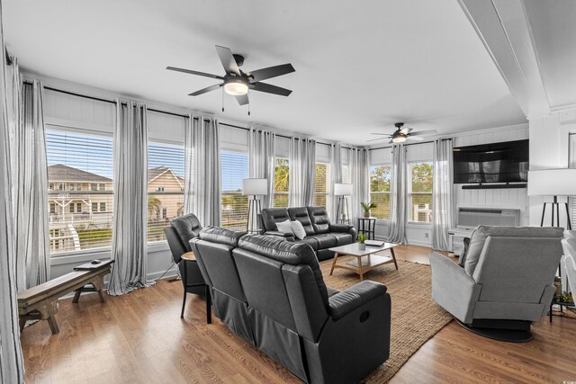 337 59th Ave N, North Myrtle Beach, SC 29582 - living room featuring a ceiling fan, wood finished floors, and cooling unit