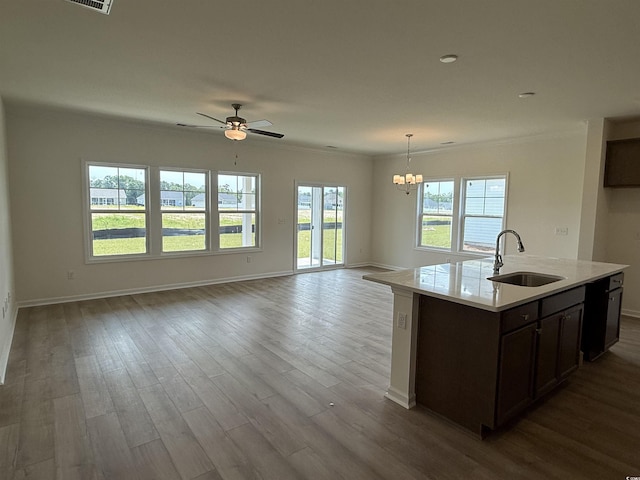 1029 Jase Dr, Longs, SC 29568 - kitchen with a sink, open floor plan, light countertops, a chandelier, and baseboards