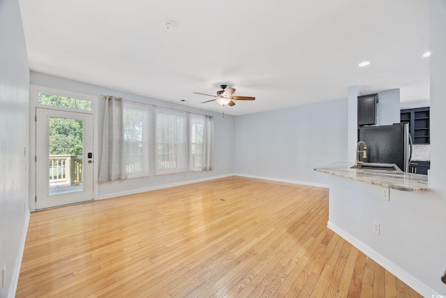 854 Falkirk St, Myrtle Beach, SC 29579 - unfurnished living room with ceiling fan, plenty of natural light, light wood finished floors, baseboards, and recessed lighting