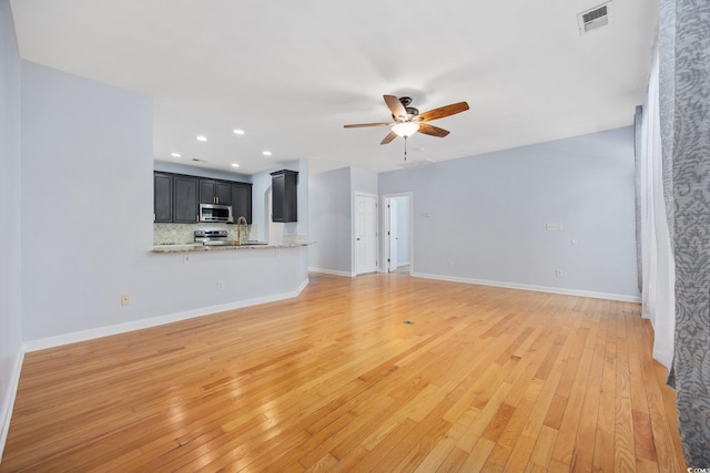 854 Falkirk St, Myrtle Beach, SC 29579 - unfurnished living room with ceiling fan, light wood-type flooring, baseboards, and recessed lighting