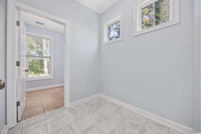 854 Falkirk St, Myrtle Beach, SC 29579 - spare room featuring baseboards and light marble finish floors