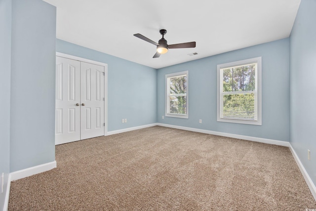 854 Falkirk St, Myrtle Beach, SC 29579 - unfurnished bedroom with carpet flooring, a closet, baseboards, and a ceiling fan