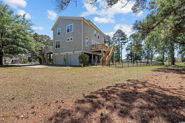 854 Falkirk St, Myrtle Beach, SC 29579 - view of side of home featuring stairs, a garage, asphalt driveway, and a deck