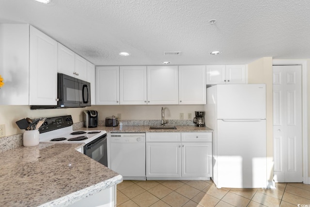 2501 S Ocean Blvd Unit 831, Myrtle Beach, SC 29577 - kitchen featuring white appliances, a sink, white cabinetry, recessed lighting, and a textured ceiling