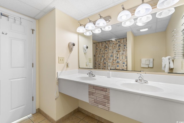 2501 S Ocean Blvd Unit 831, Myrtle Beach, SC 29577 - bathroom featuring a paneled ceiling, tile patterned floors, double vanity, curtained shower, and baseboards