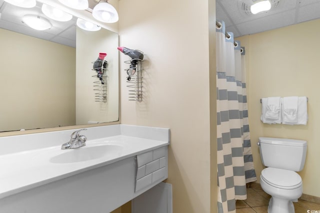 2501 S Ocean Blvd Unit 831, Myrtle Beach, SC 29577 - full bath with a drop ceiling, toilet, tile patterned floors, vanity, and curtained shower