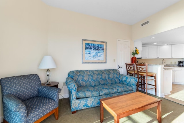 2501 S Ocean Blvd Unit 831, Myrtle Beach, SC 29577 - living room with wet bar and light colored carpet