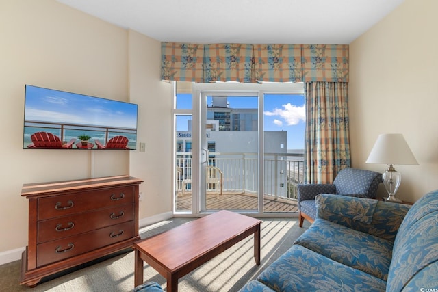 2501 S Ocean Blvd Unit 831, Myrtle Beach, SC 29577 - carpeted living area with baseboards and plenty of natural light
