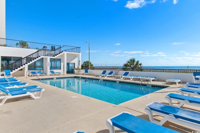2501 S Ocean Blvd Unit 831, Myrtle Beach, SC 29577 - community pool with stairs, a patio, and fence