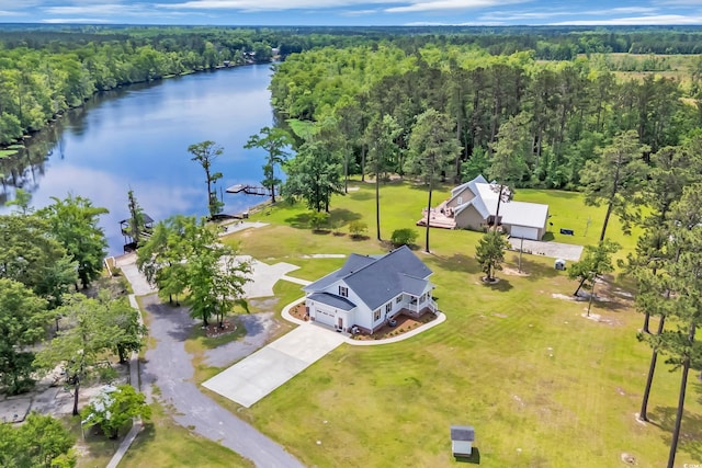 bird's eye view of a large body of water and a heavily wooded area