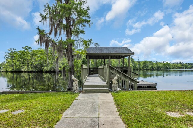 dock with a water view and a yard