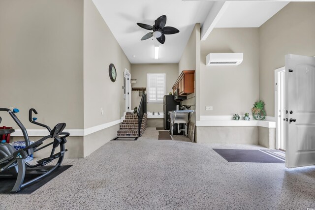 foyer featuring a wall mounted AC, a ceiling fan, and speckled floor