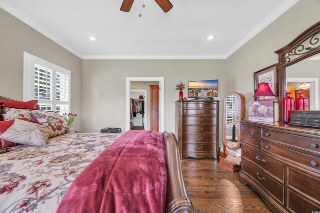 bedroom with dark wood finished floors, crown molding, ceiling fan, and recessed lighting