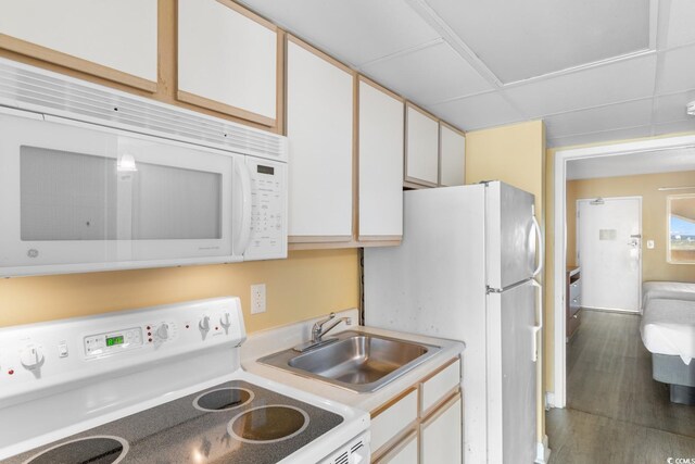 2000 Ocean Blvd N Unit Ph11, Myrtle Beach, SC 29577 - kitchen with white appliances, a sink, light countertops, wood finished floors, and white cabinets