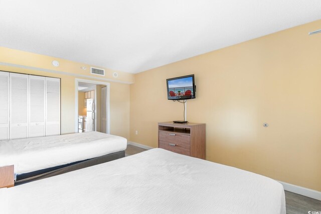 2000 Ocean Blvd N Unit Ph11, Myrtle Beach, SC 29577 - bedroom featuring freestanding refrigerator, baseboards, and a closet