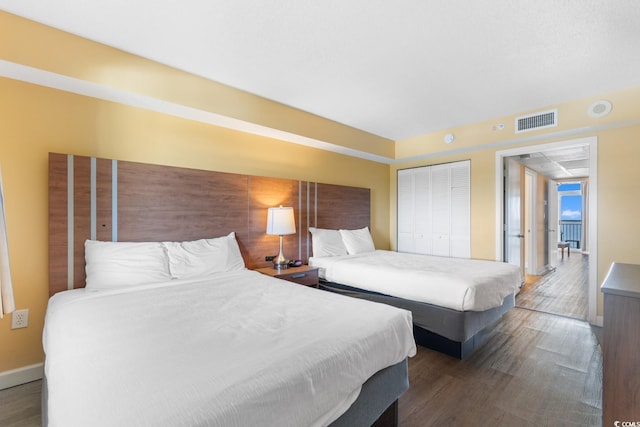 2000 Ocean Blvd N Unit Ph11, Myrtle Beach, SC 29577 - bedroom with wood finished floors, a closet, and baseboards