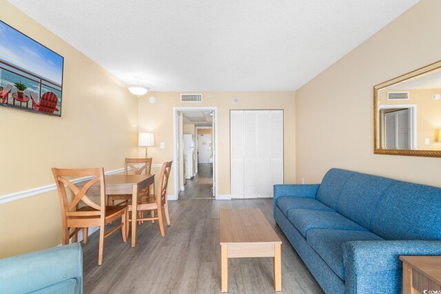 2000 Ocean Blvd N Unit Ph11, Myrtle Beach, SC 29577 - living area with wood finished floors and baseboards