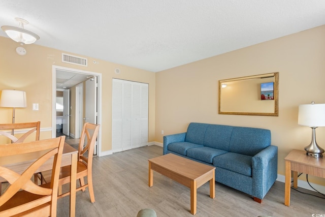 2000 Ocean Blvd N Unit Ph11, Myrtle Beach, SC 29577 - living area featuring light wood-type flooring and baseboards