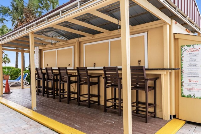 2000 Ocean Blvd N Unit Ph11, Myrtle Beach, SC 29577 - view of patio featuring exterior bar and a wooden deck