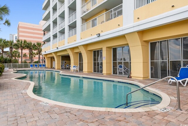 2000 Ocean Blvd N Unit Ph11, Myrtle Beach, SC 29577 - community pool with a patio area and fence