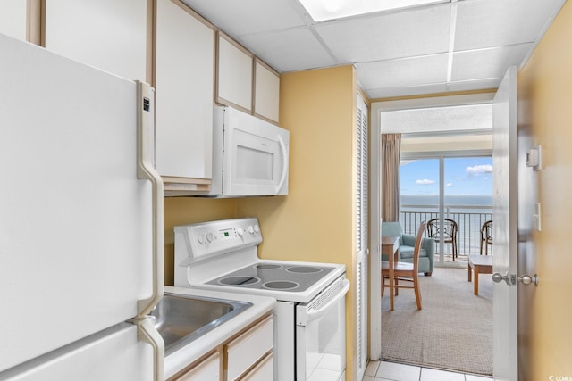 2000 Ocean Blvd N Unit Ph12, Myrtle Beach, SC 29577 - laundry area with light carpet, light tile patterned flooring, and a sink